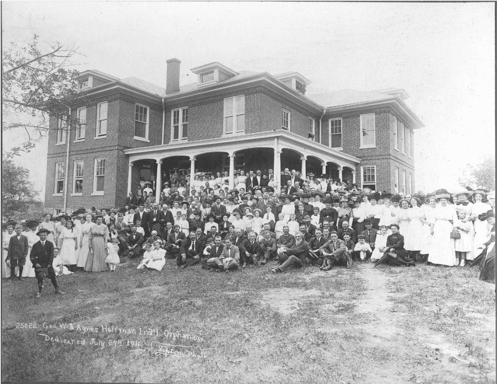 Dedication day at Hoffman Homes, July 27, 1911 - community gathered at the original building